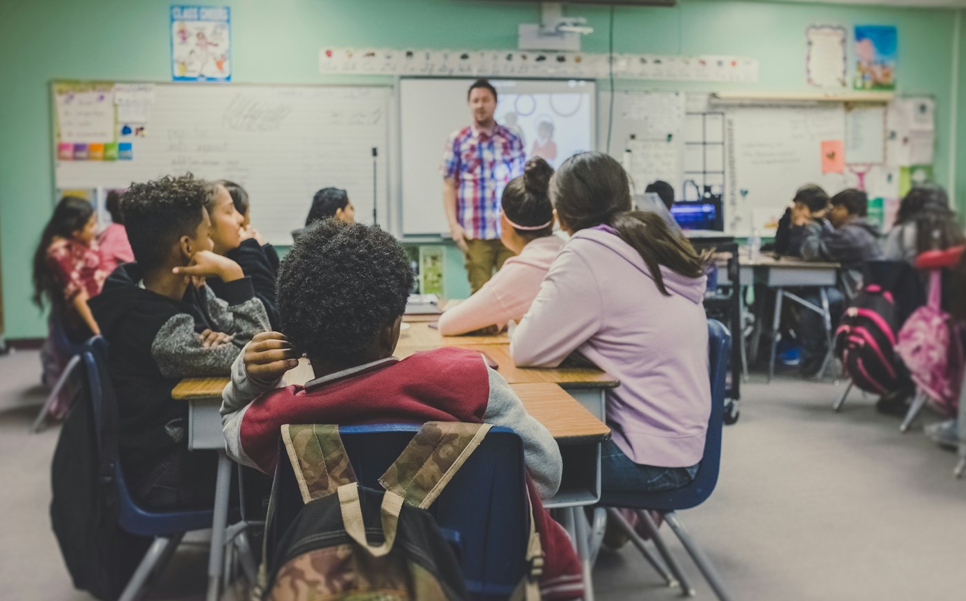 Teacher working with students in a school classroom for Mohali teaching jobs